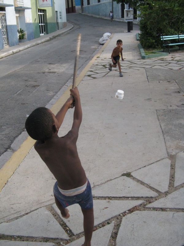 Matanzas boys playing baseball pill bottle boy swing swinging sidewalk street