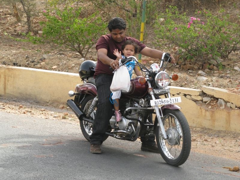 Jaipur motorcyle child girl waving