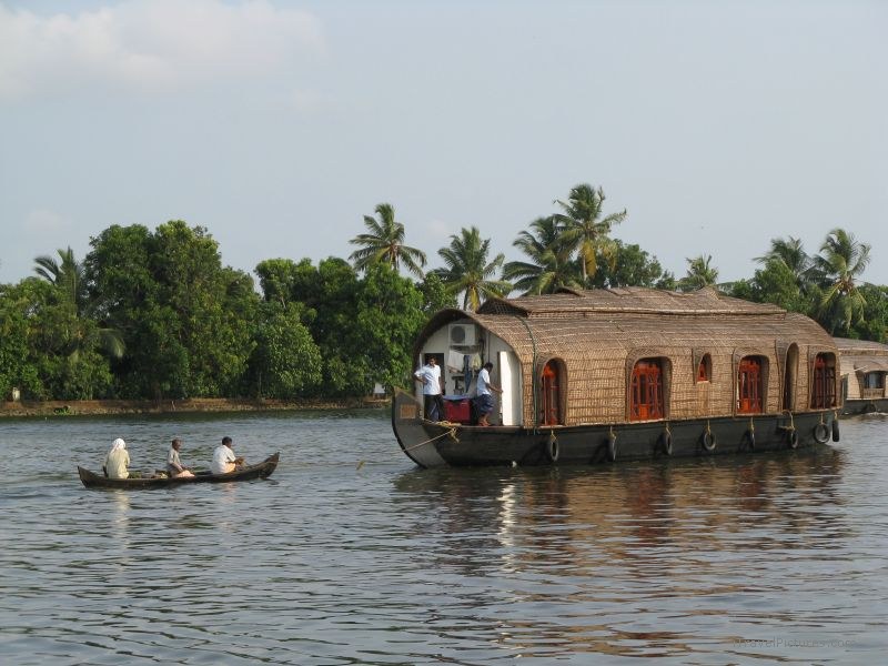 Keralan backwaters houseboat toeing boat  water