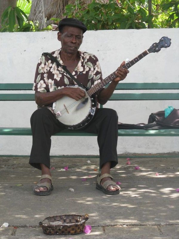 Casco Viejo man playing banjo music busker