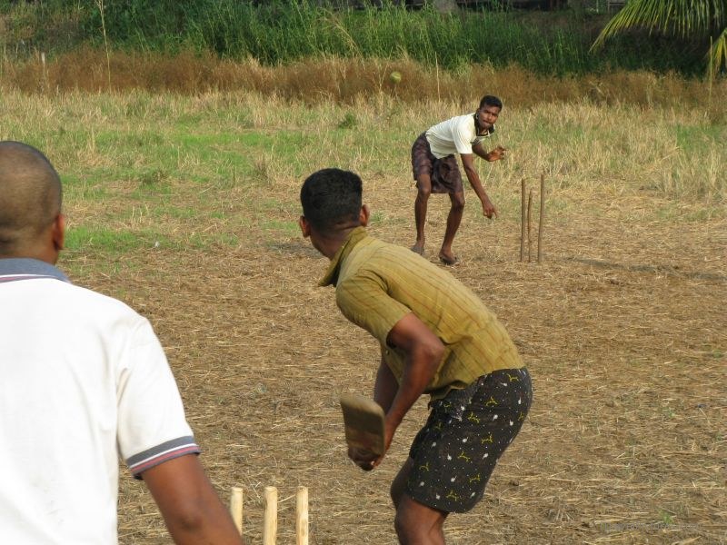 Keralan backwaters cricket playing sport  throwing batting bat