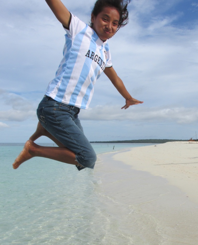 irl jumping Argentina water beach sand