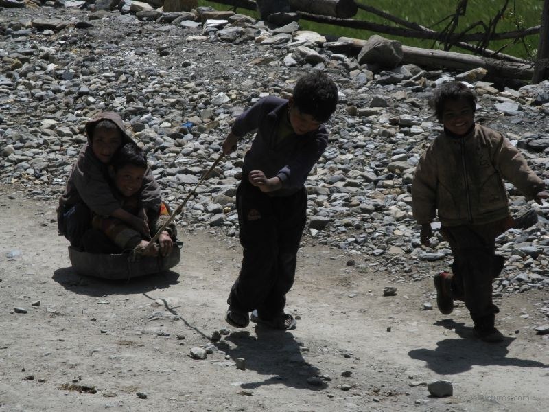 Jomsom trek children playing play pulling