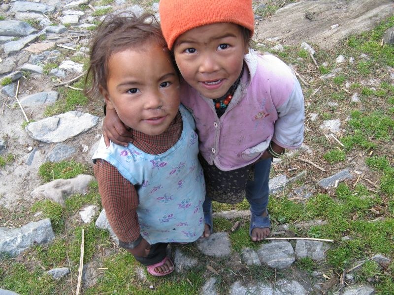 Jomsom trek girl hugging hug children