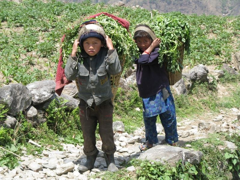 Chaliss children carrying boy girl